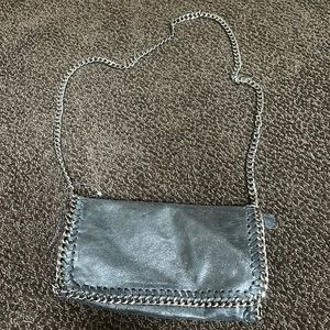 Stella McCarthy look alike bag! Black shiny with silver hard ware
